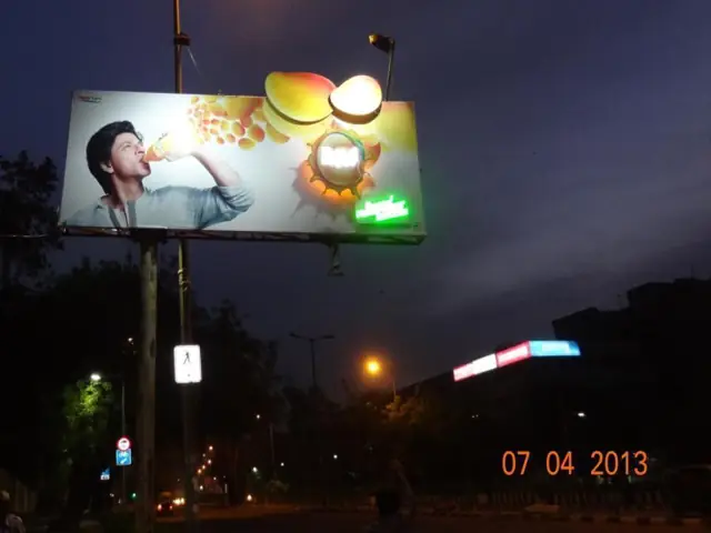 Beverage billboard lit at night