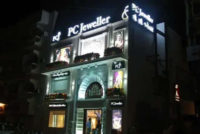 PC Jeweller store front at night